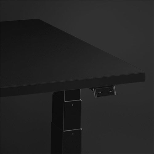 Nevi Gaming Desk surface close-up featuring the easy-touch adjustment switch with dark grey background