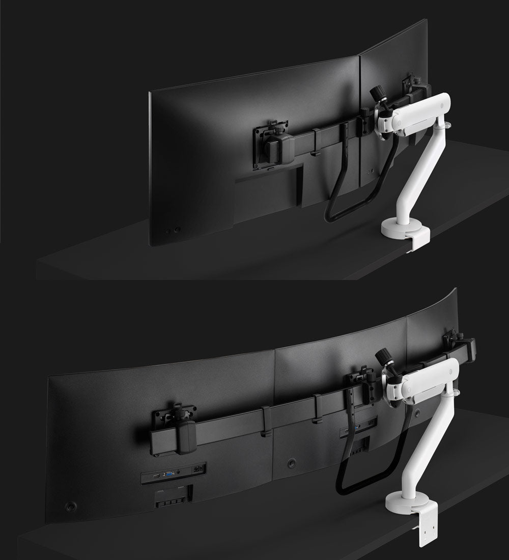 A Flo X monitor arm holding an ultrawide monitor