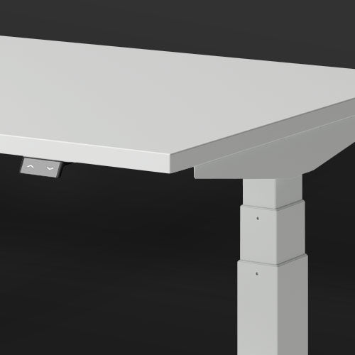 A white-topped Nevi Gaming Desk close-up featuring the easy-touch adjustment switch with dark grey background