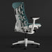 Angled view of the back of a blue-green and white Herman Miller X Logitech Embody gaming chair in Galaxy